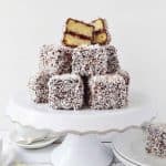 Jam lamingtons - squares of vanilla sponge cake filled with cherry jam, coated in chocolate and coconut - Domestic Gothess