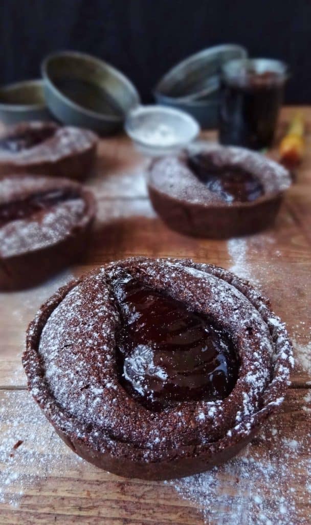 Spiced red wine poached pear & chocolate frangipane tarts with chocolate pastry