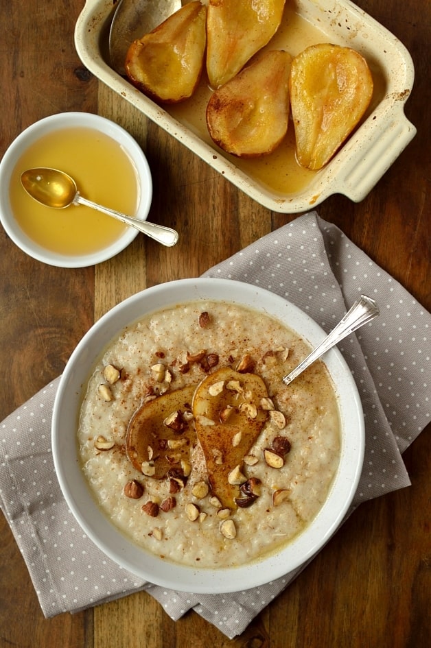 Vanilla almond milk oatmeal with honey roast pear, cinnamon and hazelnuts; dairy free and easily adaptable to be vegan.