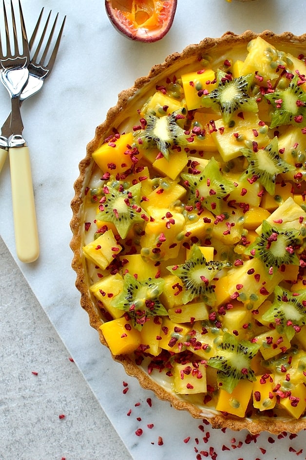 Tropical fruit coconut tart - cripsy coconut pastry shell filled with coconut milk creme patissiere and tropical fruits