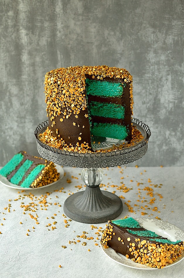 Chocolate and vanilla gold sprinkles cake - layers of turquoise American white cake with chocolate fudge frosting and gold sprinkles