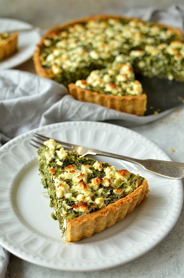 Spinach, ricotta and feta cheese quiche with parmesan pastry (spanakopita tart)