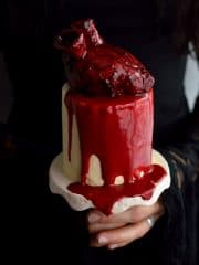 Mini red velvet layer cakes with cooked flour frosting, bloody heart cakes and gananche 'blood'; ideal for Halloween