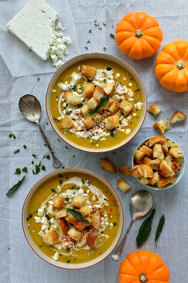 Warmly spiced roasted pumpkin soup with garlicky croutons, feta cheese and fried sage