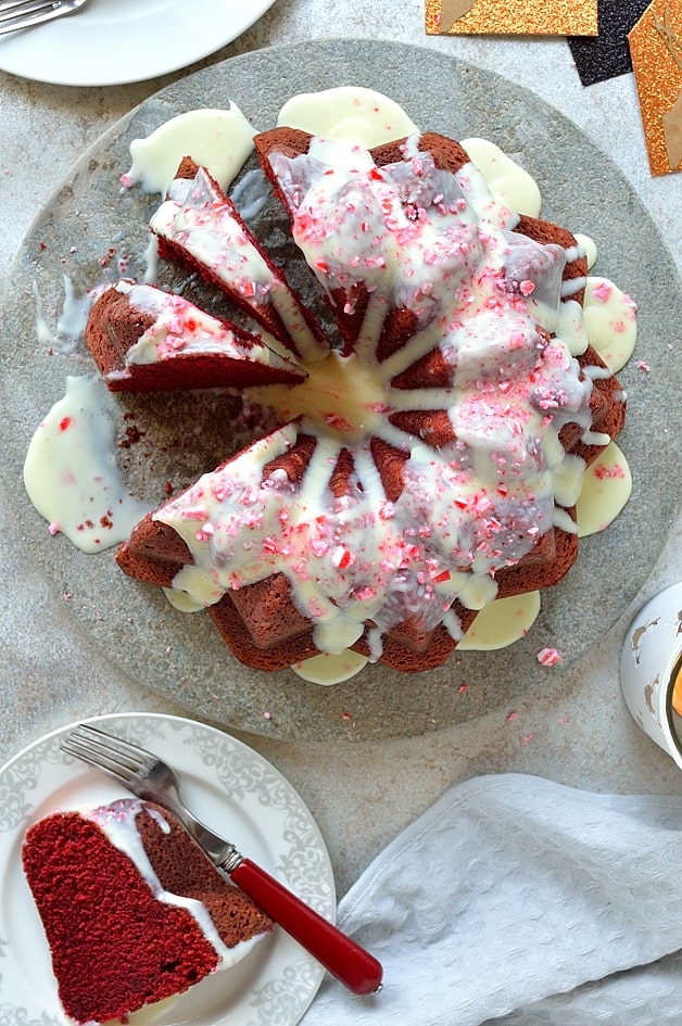 Red velvet bundt cake with white chocolate peppermint cream cheese glaze - the perfect festive cake!