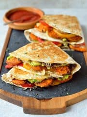 Loaded veggie quesadillas - delicious, filling, healthy quesadillas stuffed with spiced roasted sweet potato, peppers, black beans, avocado, cream cheese and cheddar.