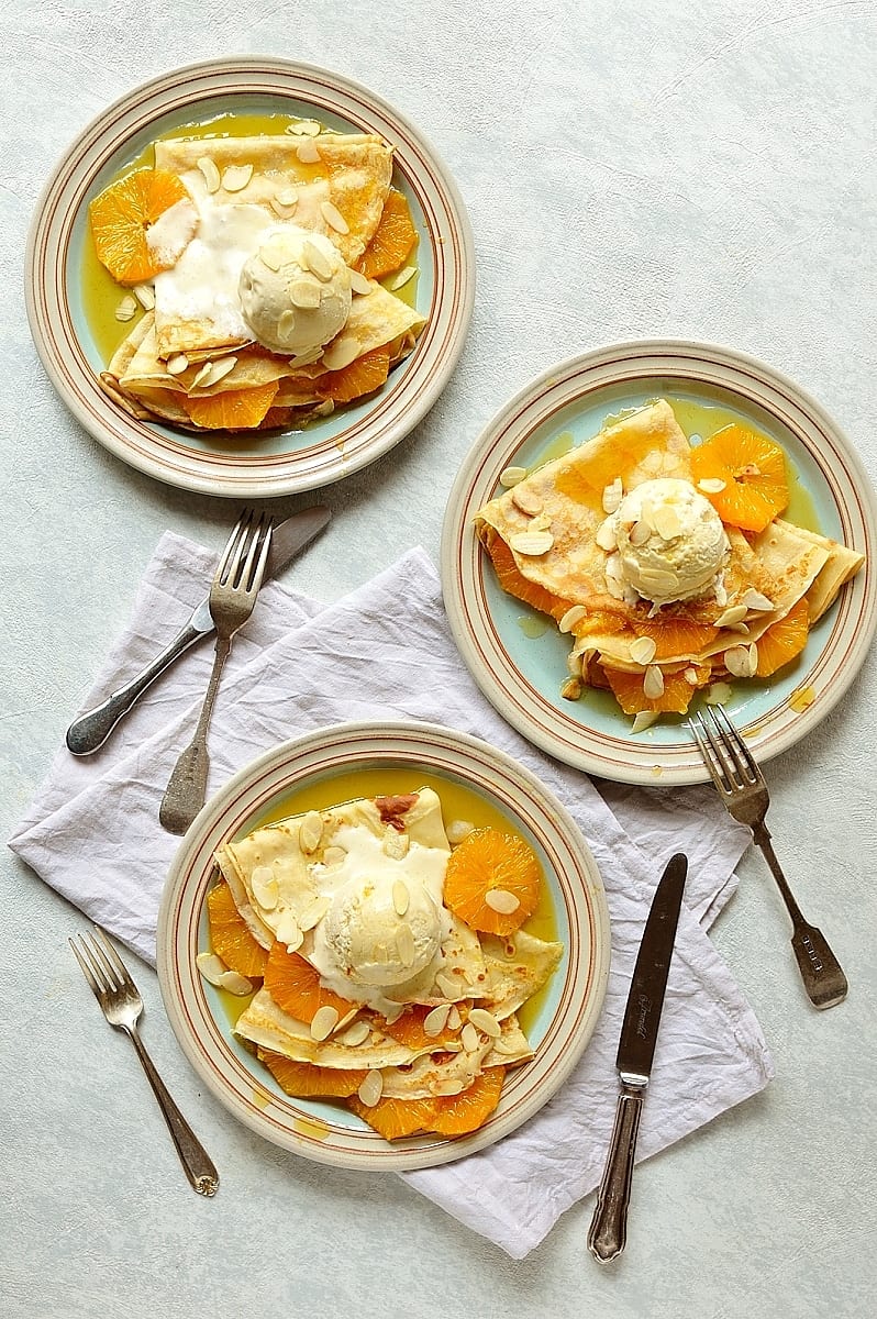 Pancakes (crepes) with caramel oranges and almond ice cream - an indulgent dessert or brunch!