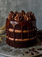 Chocolate coffee cardamom layer cake - three layers of moist chocolate coffee cardamom cake with swiss meringue buttercream and dark chocolate ganache.