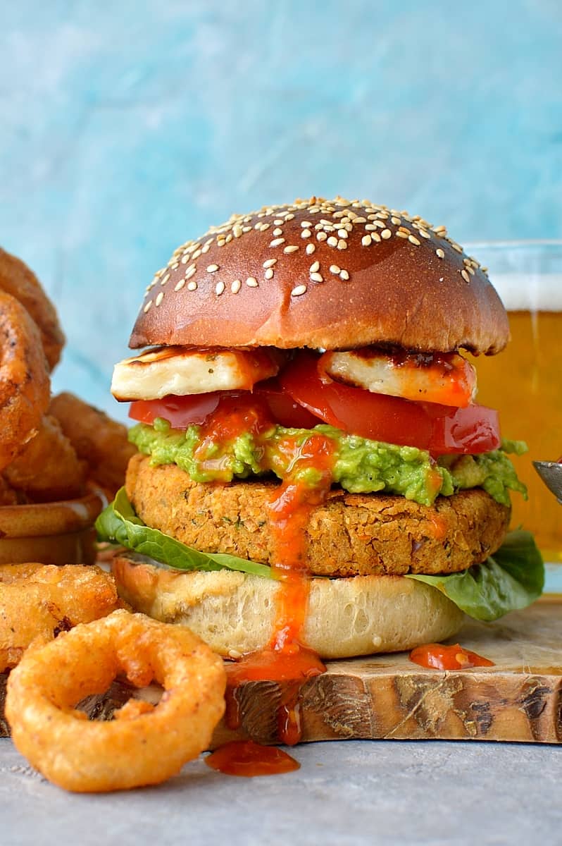 Sun-dried tomato chickpea burgers and beer battered onion rings - delicious vegetarian/vegan burgers served with the most amazing onion rings!