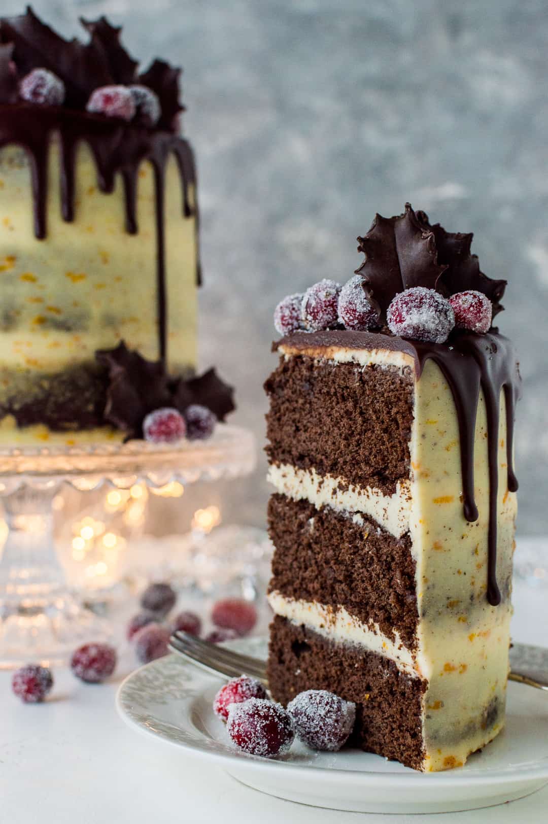 A slice of mulled red wine chocolate cake with orange mascarpone frosting.