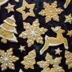 Top down shot of orange cinnamon butter biscuits in reindeer, Christmas tree, star and snowflake shapes