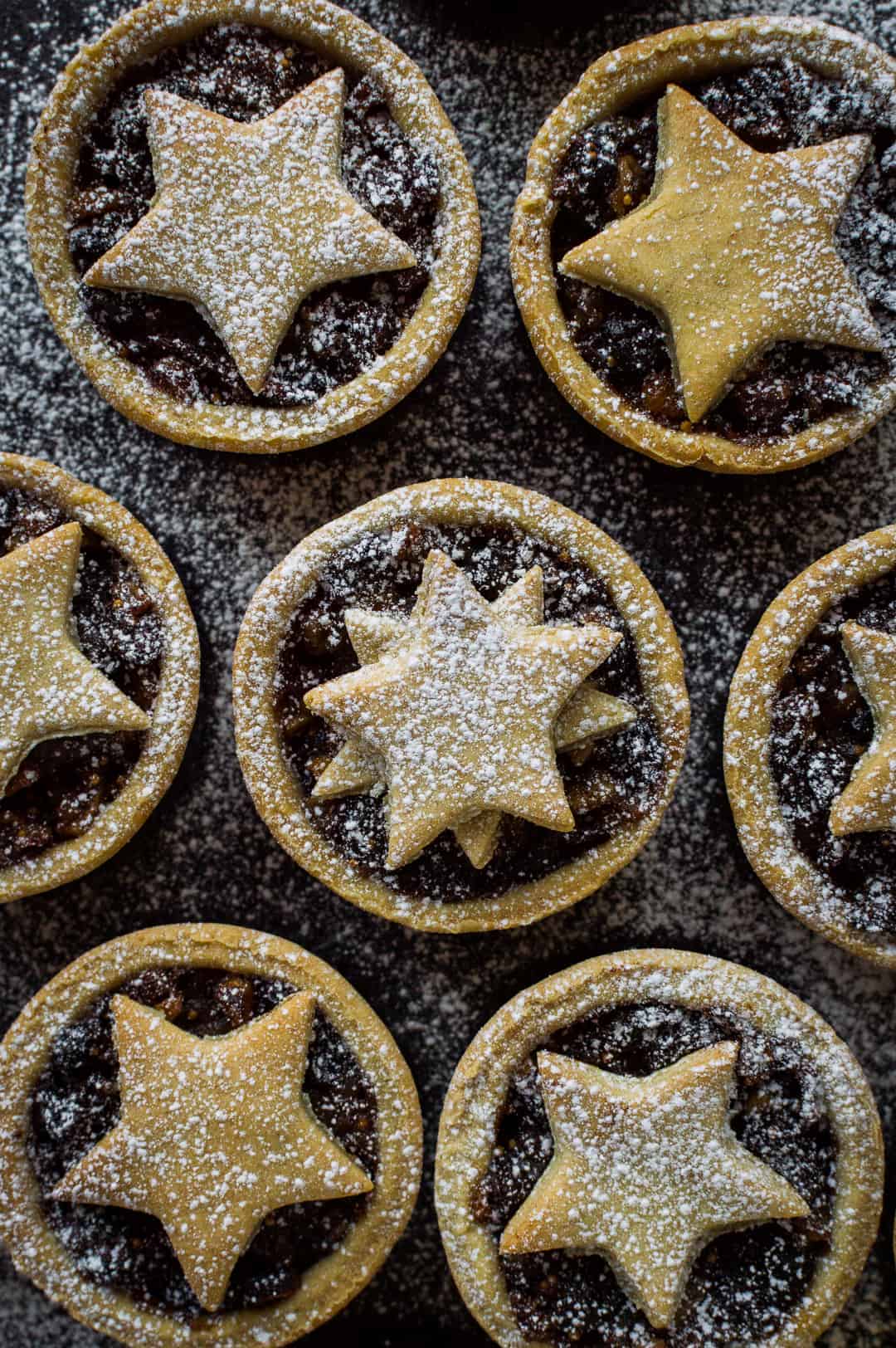 Close up shot of lighter mince pies dusted with icing sugar