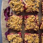 Vegan berry oat crumble bars with mixed berries and raspberry jam