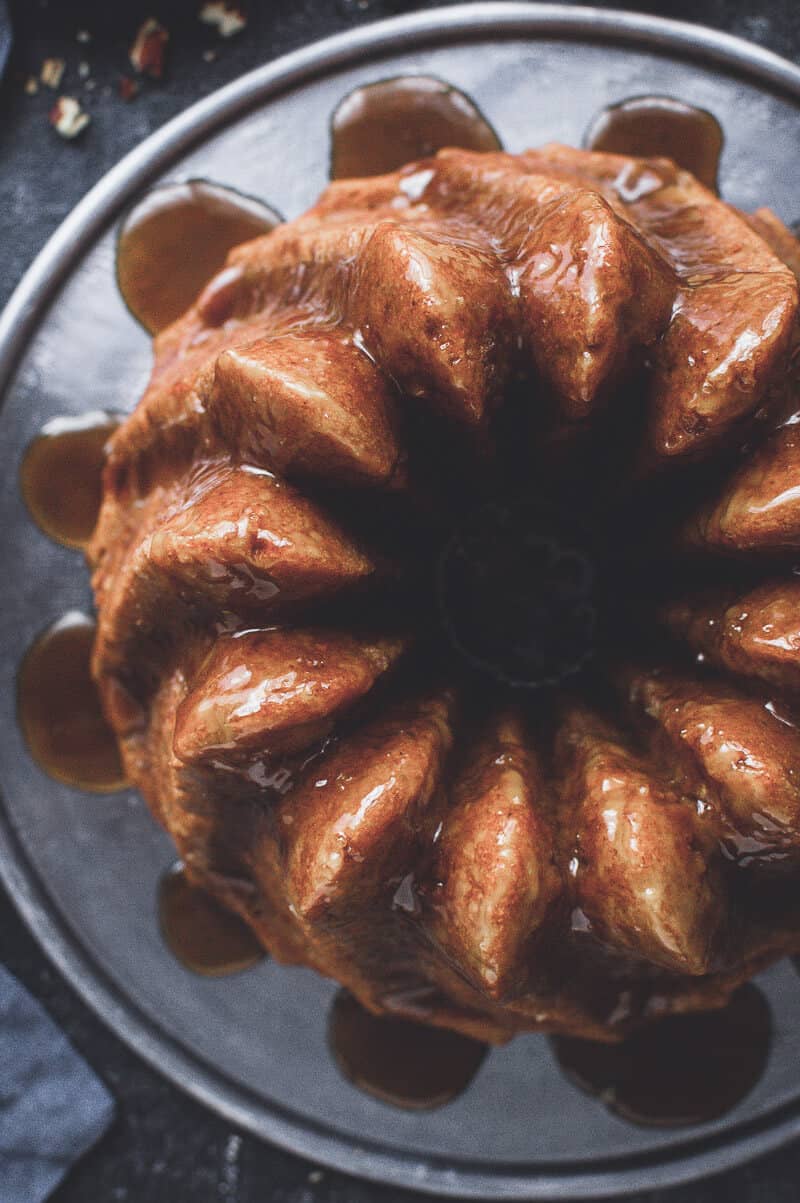 Close up top down shot of vegan apple bundt cake topped with coconut caramel.