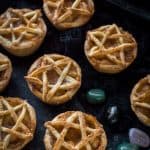 Pentagram topped vegan apple pies for Halloween - these mini vegan apple pies are topped with a pastry pentagram; perfect for Halloween and fans of Supernatural! Step by step instructions included. #vegan #Halloween #applepie