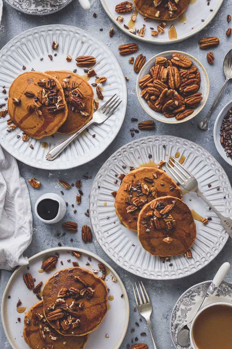 Vegan pumpkin pancakes - super fluffy, lightly spiced, easy to make and utterly delicious; these pancakes are perfect for a cozy Autumn breakfast. #vegan #pumpkin #pumpkinspice #pancakes #brunch