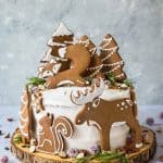 Woodland animal ginger cake - this impressive vegan ginger cake with lemon curd, cream cheese frosting and whimsical gingerbread woodland animals is a real festive showstopper for Christmas! #vegan #Christmas #gingerbread