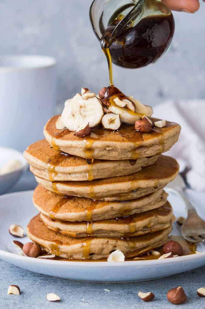 Fluffy vegan banana pancakes - these American style vegan pancakes are easy to make, super fluffy and perfect for breakfast or brunch. #vegan #pancakes #bananapancakes #veganpancakes