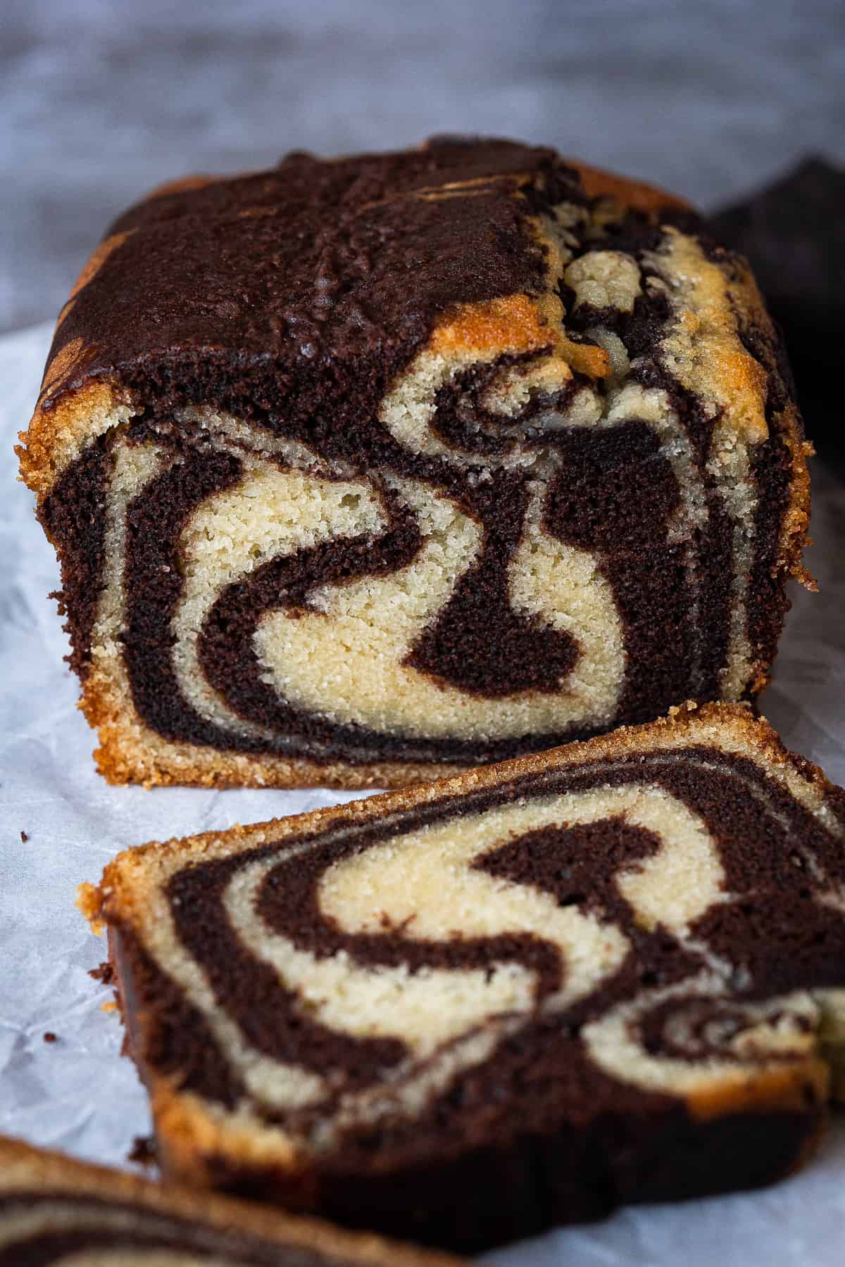Close up of the end of a loaf of sliced marble cake