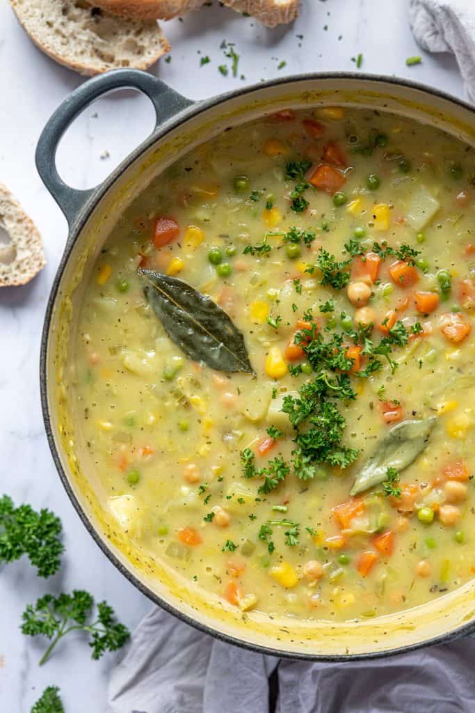 Close up of creamy vegetable chickpea soup in a pan.