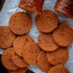 Close up of slices of seitan pepperoni.