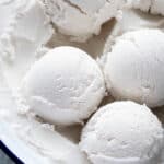 Close up of scoops of easy coconut ice cream.