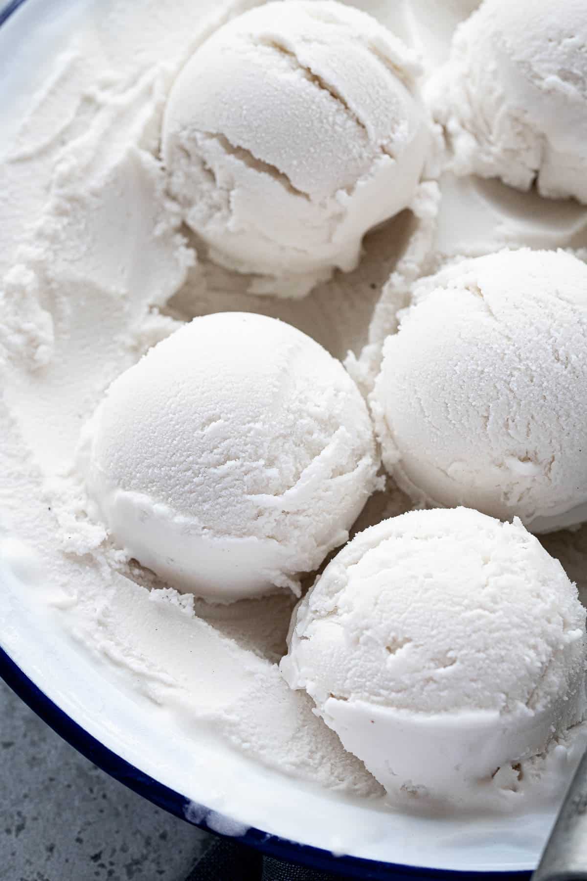 Close up of scoops of easy coconut ice cream.
