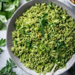 Close up of a bowl of herby green rice.