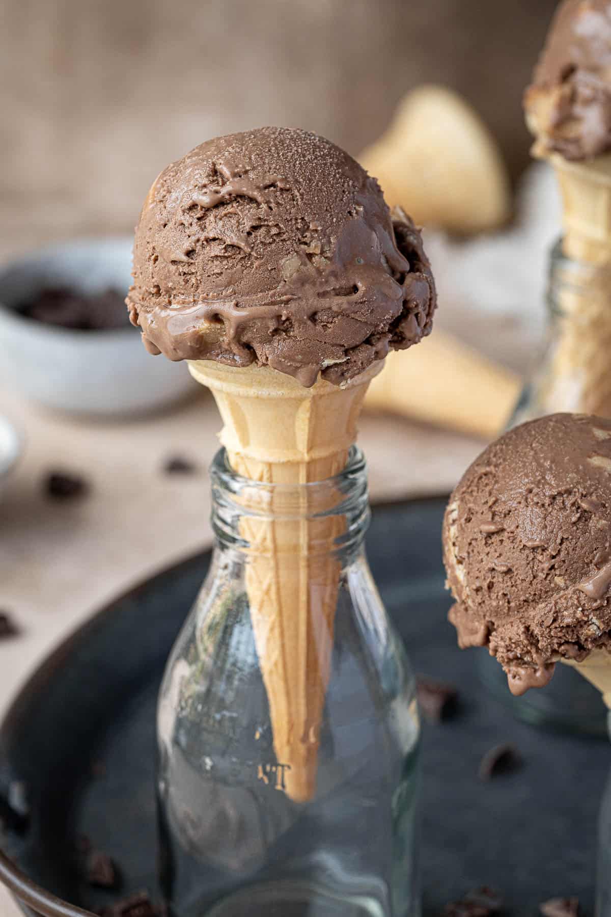 Close up of a cone of chocolate peanut butter ice cream.