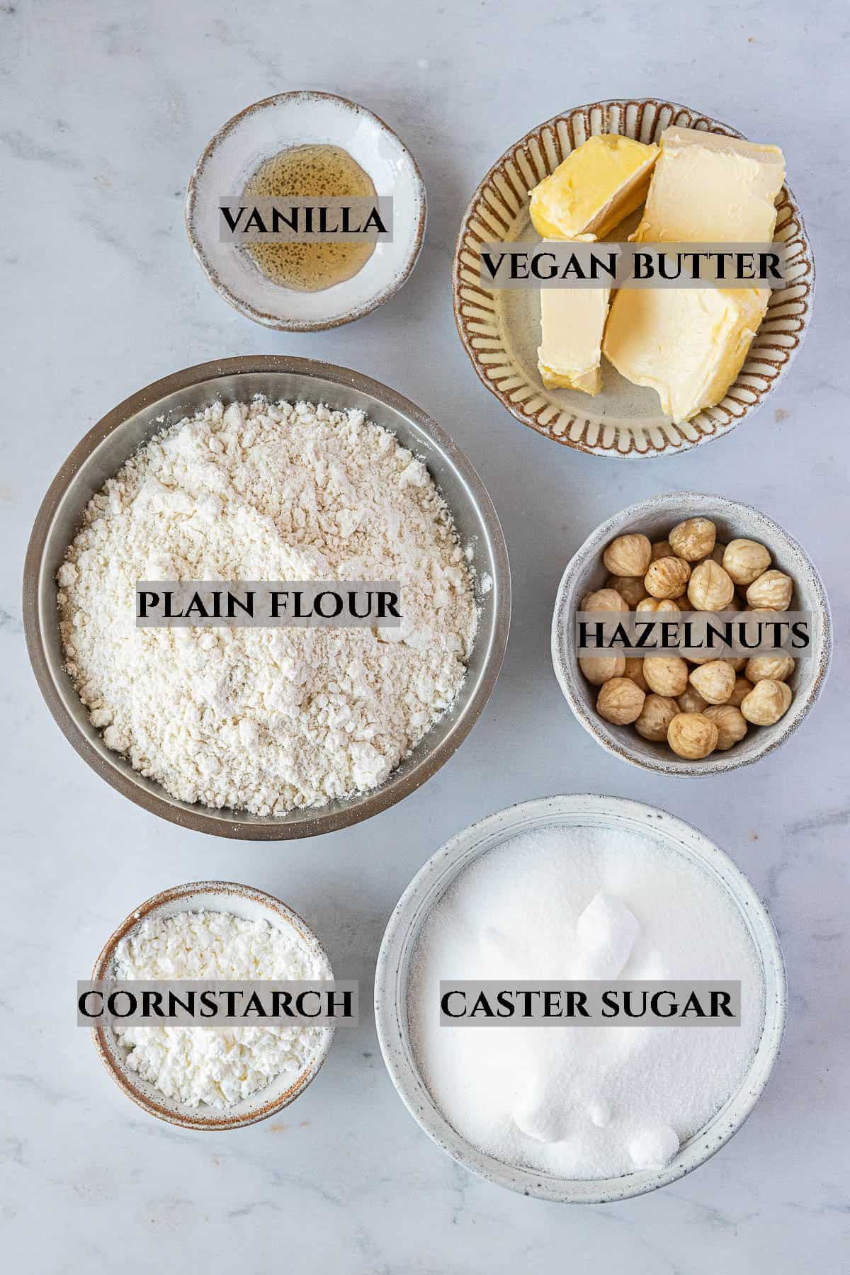 A photo of the ingredients needed to make hazelnut shortbread, with labels.