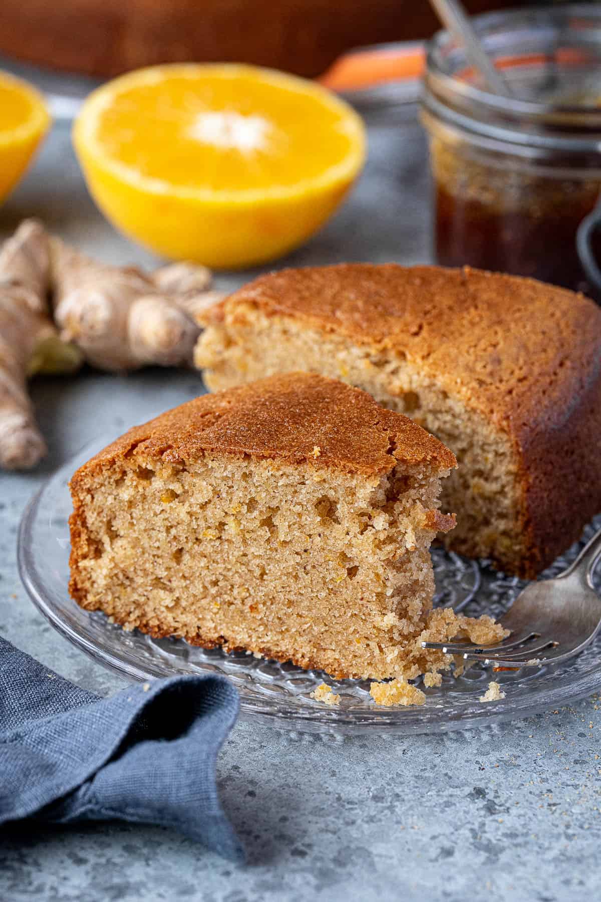 A slice of marmalade and ginger cake with a forkful removed.