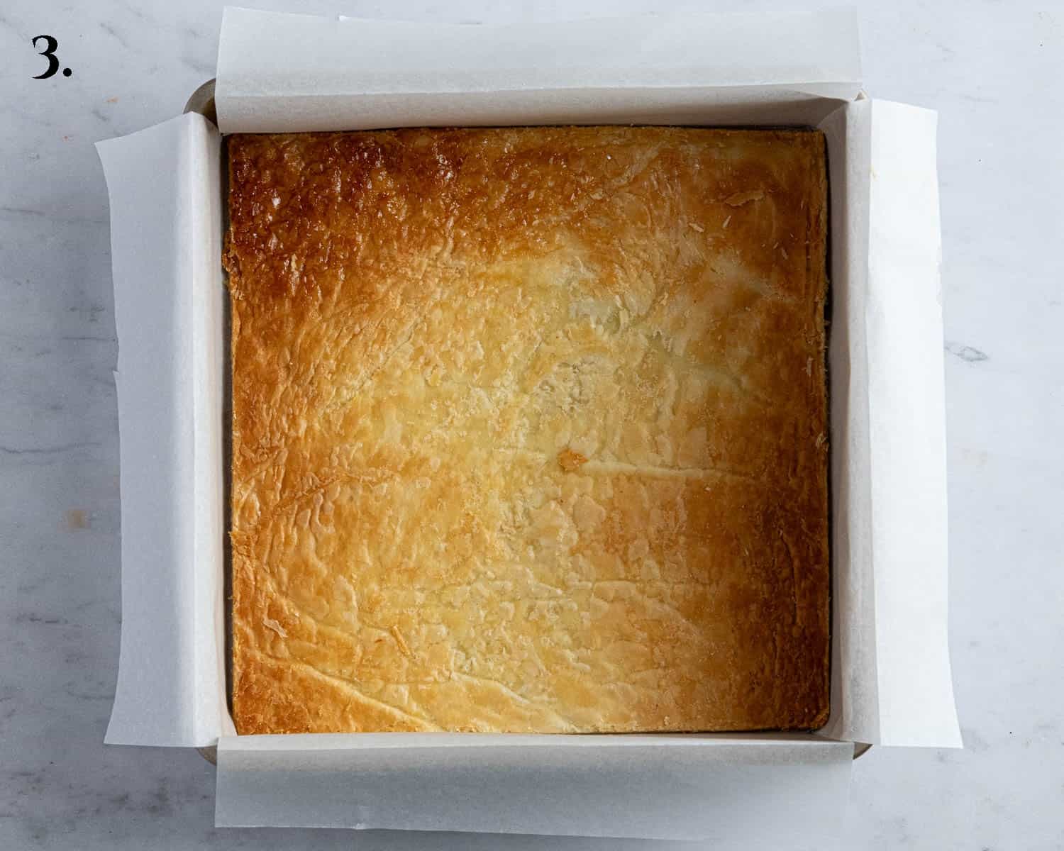 Step 3, the pastry square in the tin.