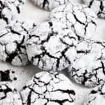 Vegan chocolate crinkle cookies on a white background.