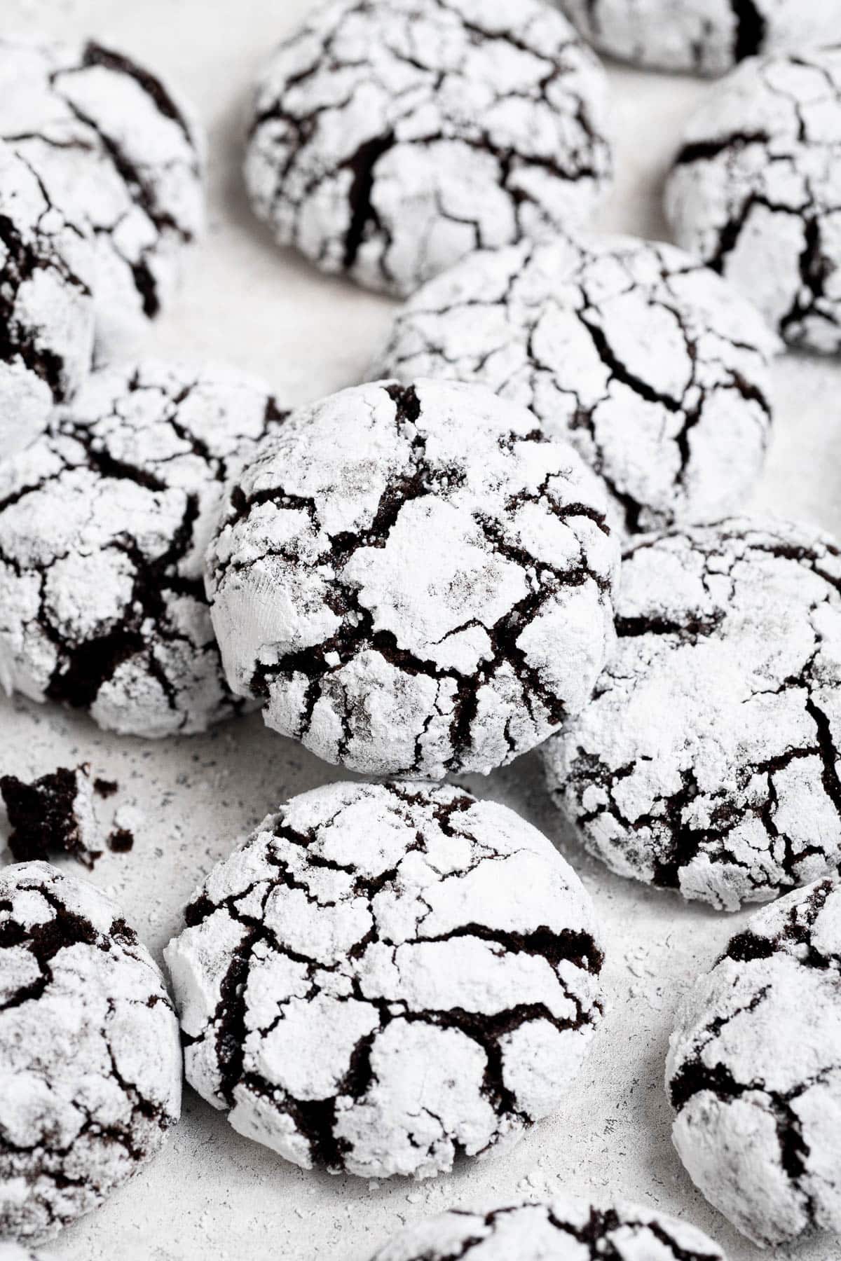 Vegan chocolate crinkle cookies on a white background.
