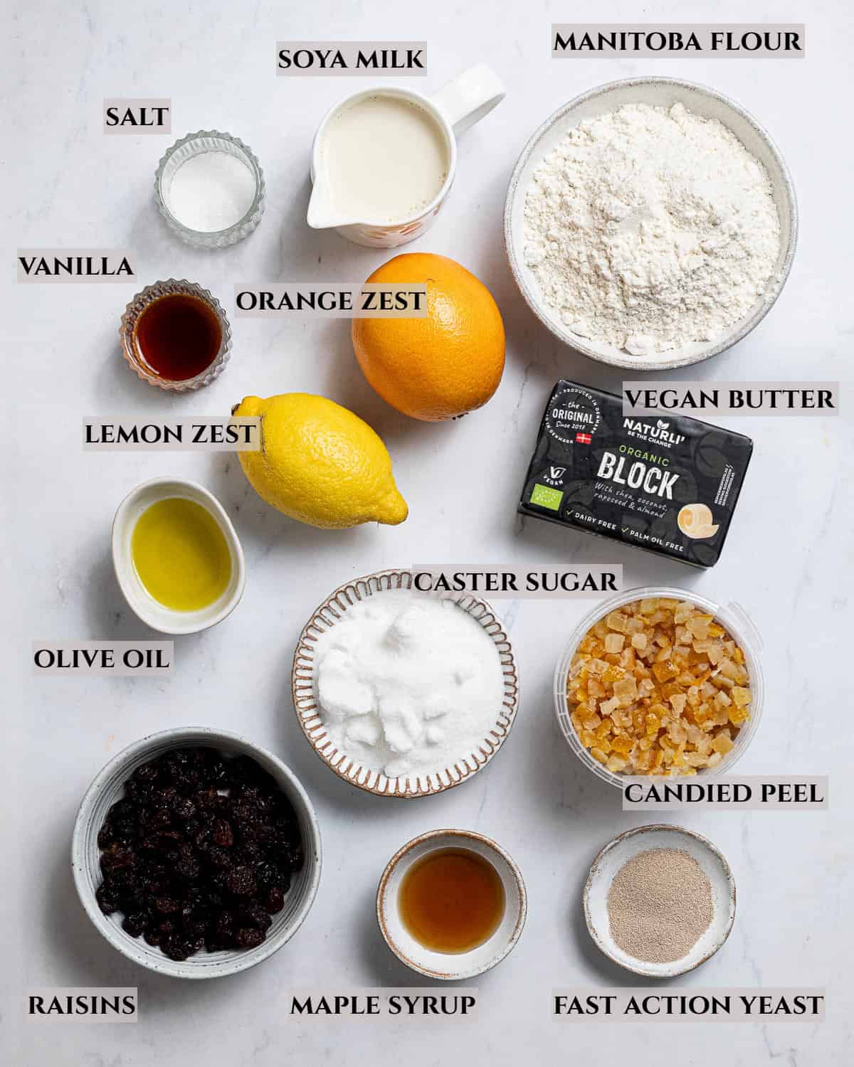 A labelled photo of the ingredients needed to makew vegan panettone.