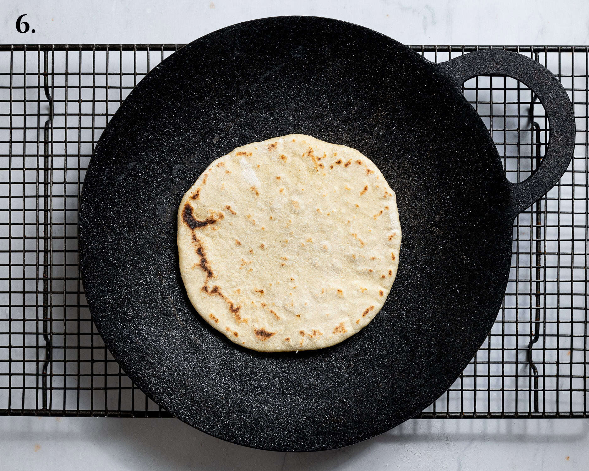 Step 6, the cooked flatbread in a pan.