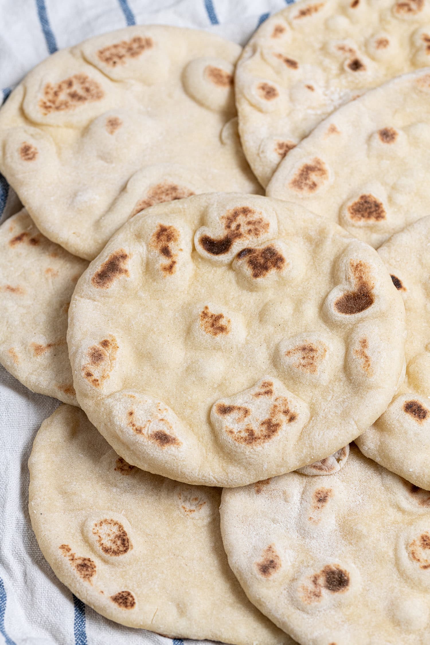 Vegan yogurt flatbreads on a tea towel.