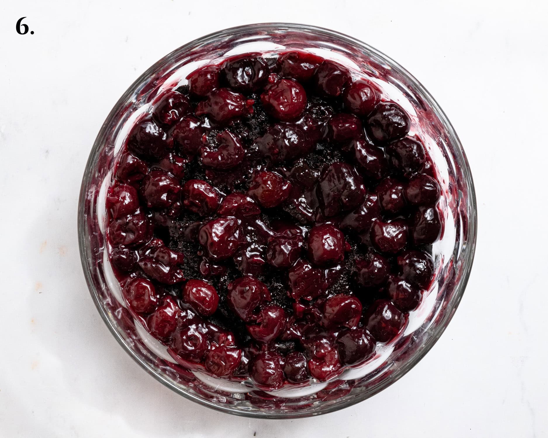 Step 6, the cherry compote layer in the trifle dish.