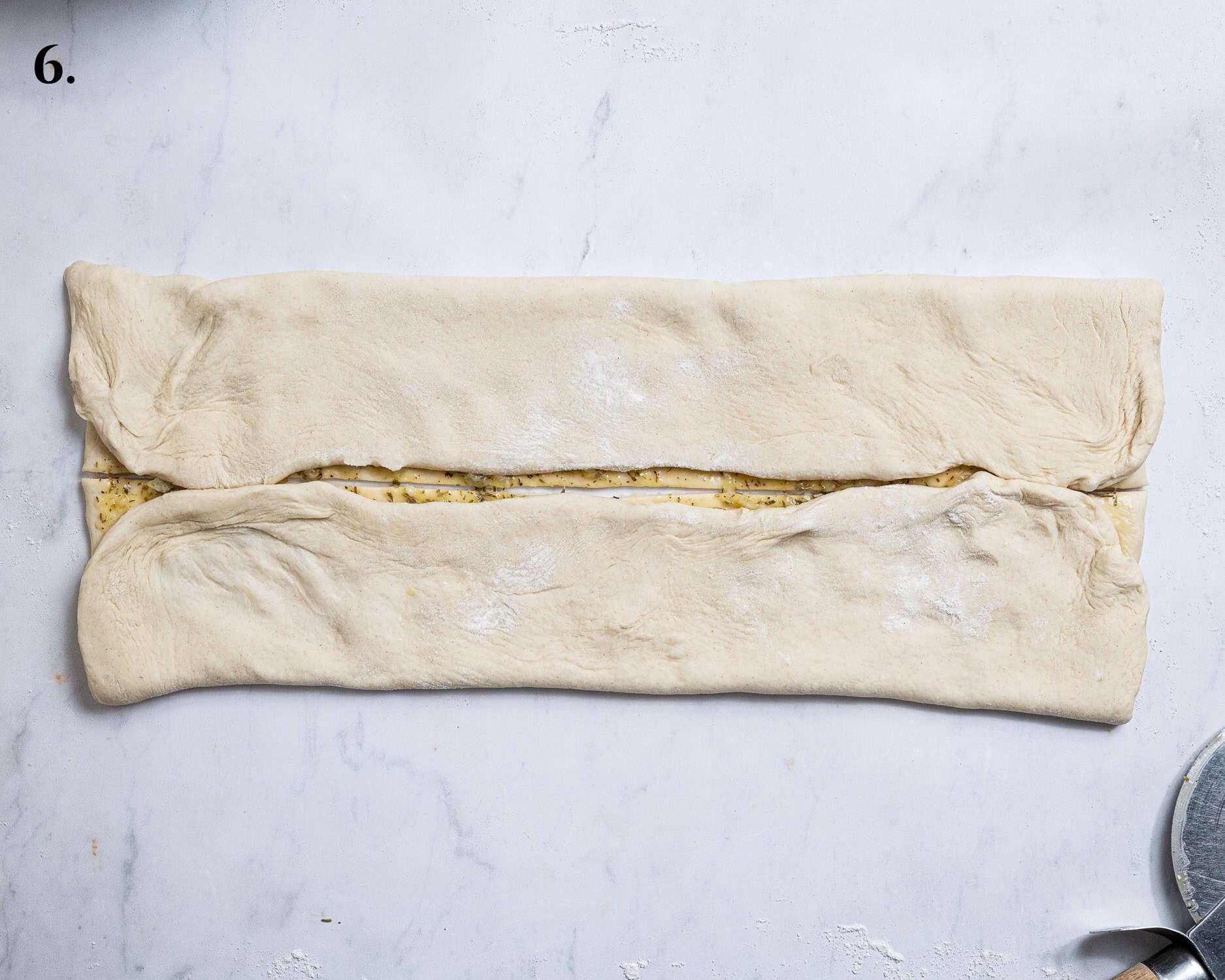 Step 6, the dough folded into halves.
