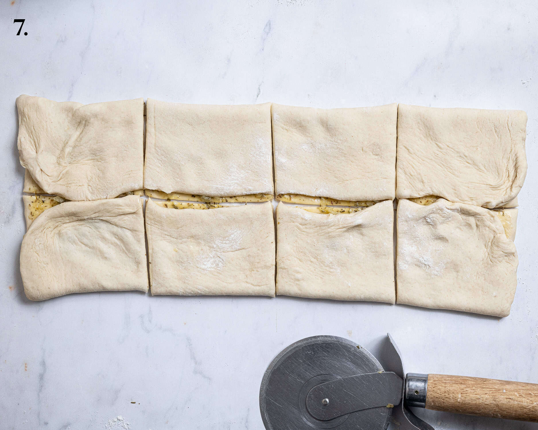 Step 7, the dough sliced into squares.