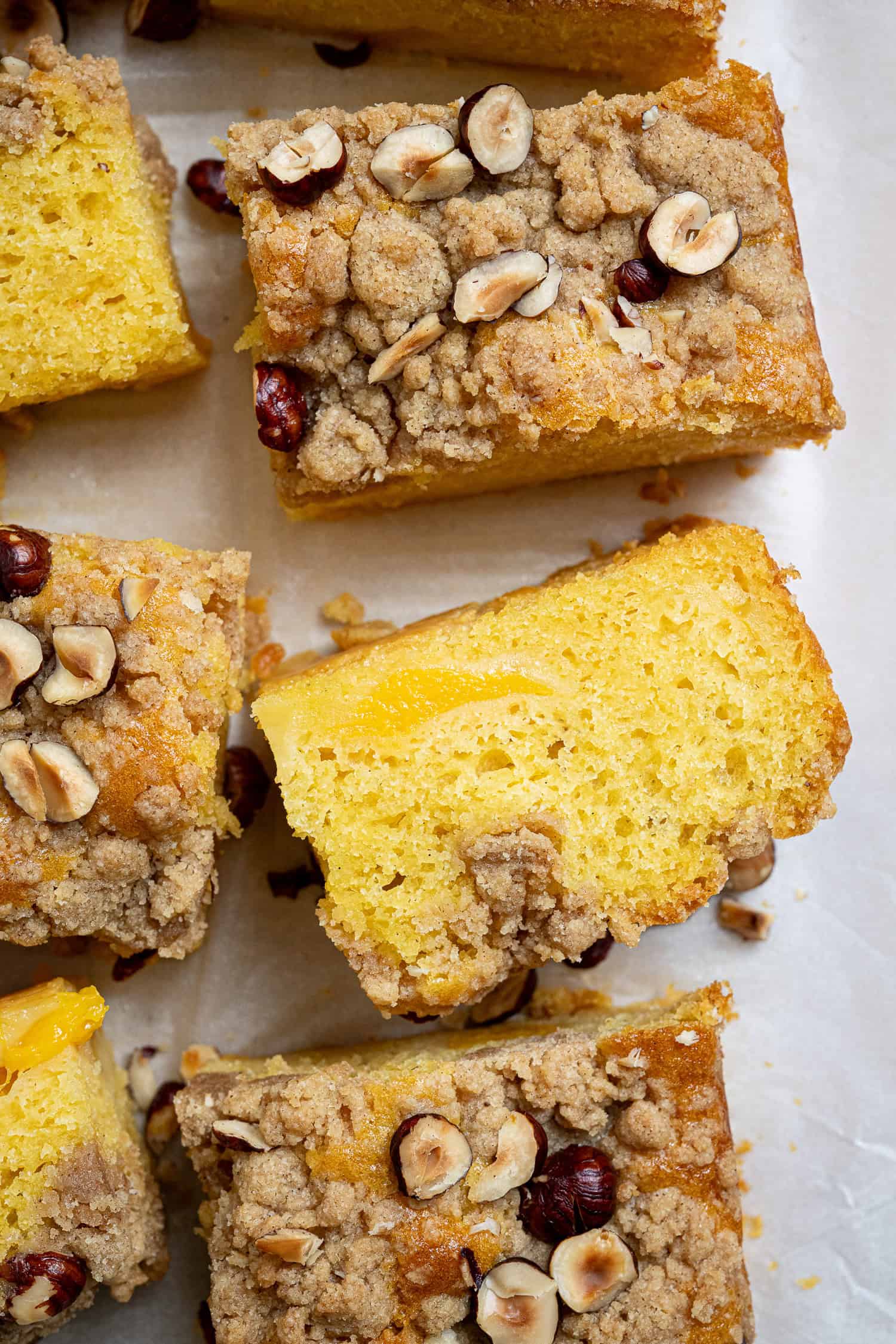 Close up of a slice of vegan peach crumble cake.