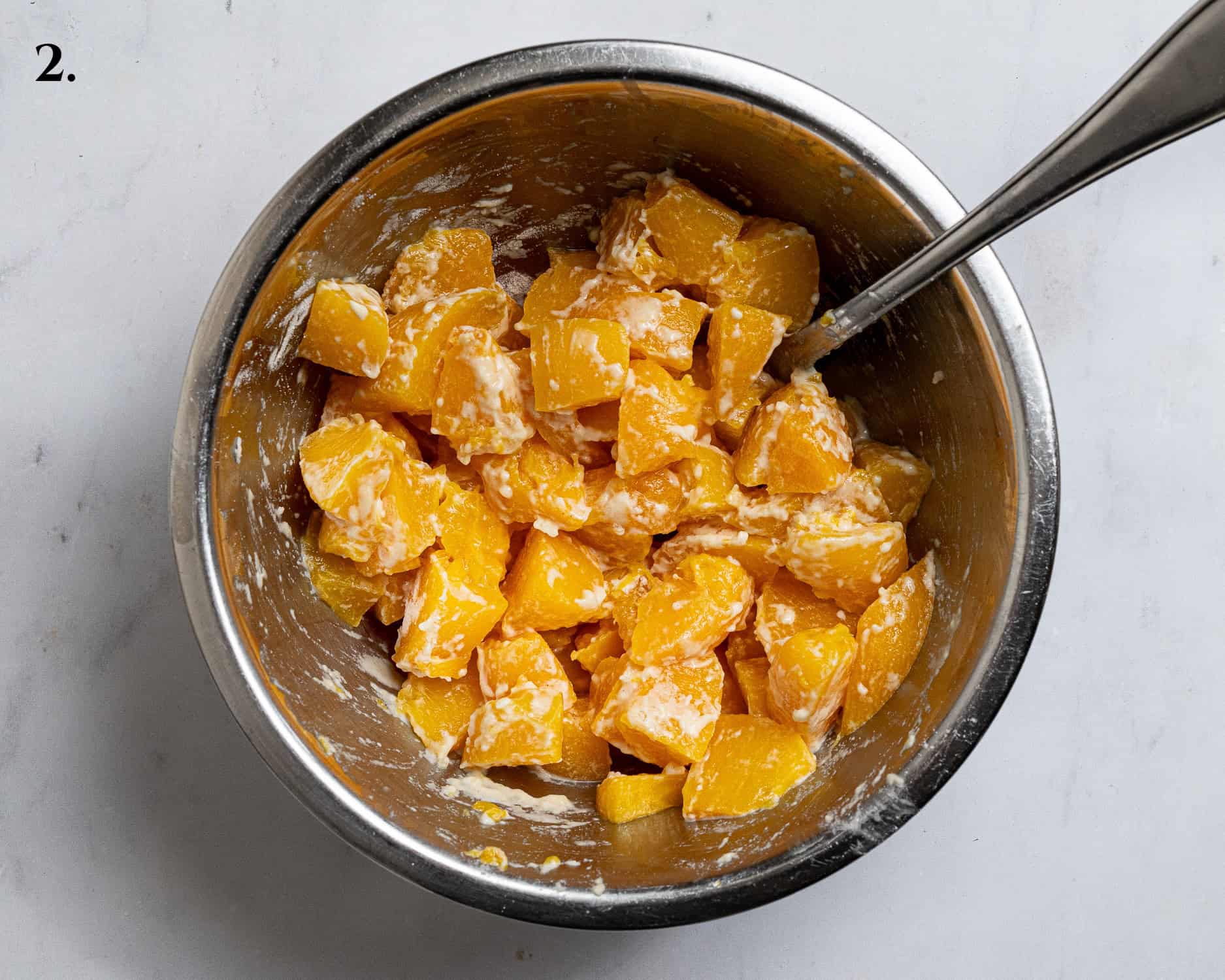 Step 2, the flour coated peaches in a bowl.