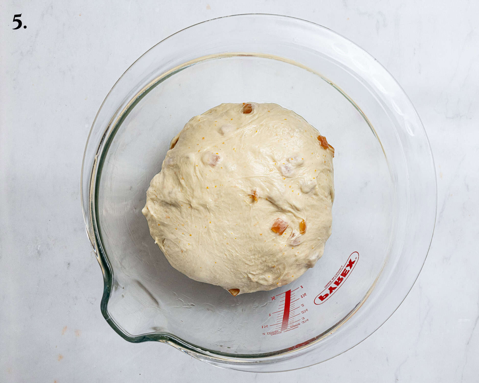 Step 5, the dough with the candied peel added, shaped into a ball in a bowl.