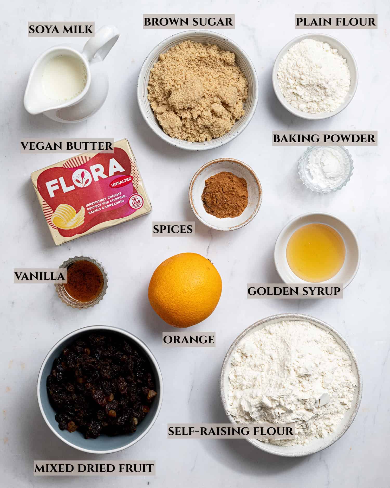 A labelled photo of the ingredients needed to make vegan hot cross scones.