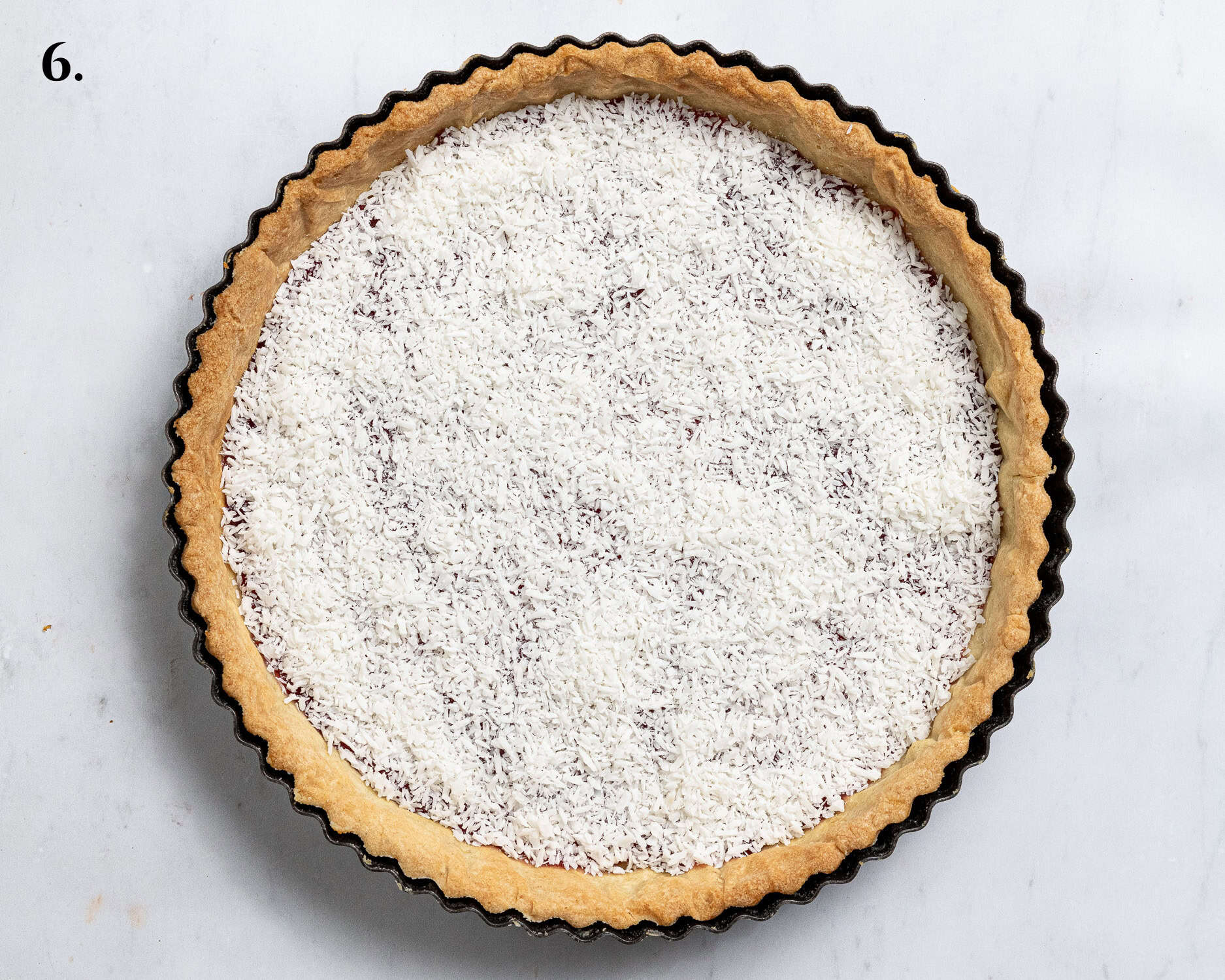 Step 6, the pastry case filled with the jam and coconut.