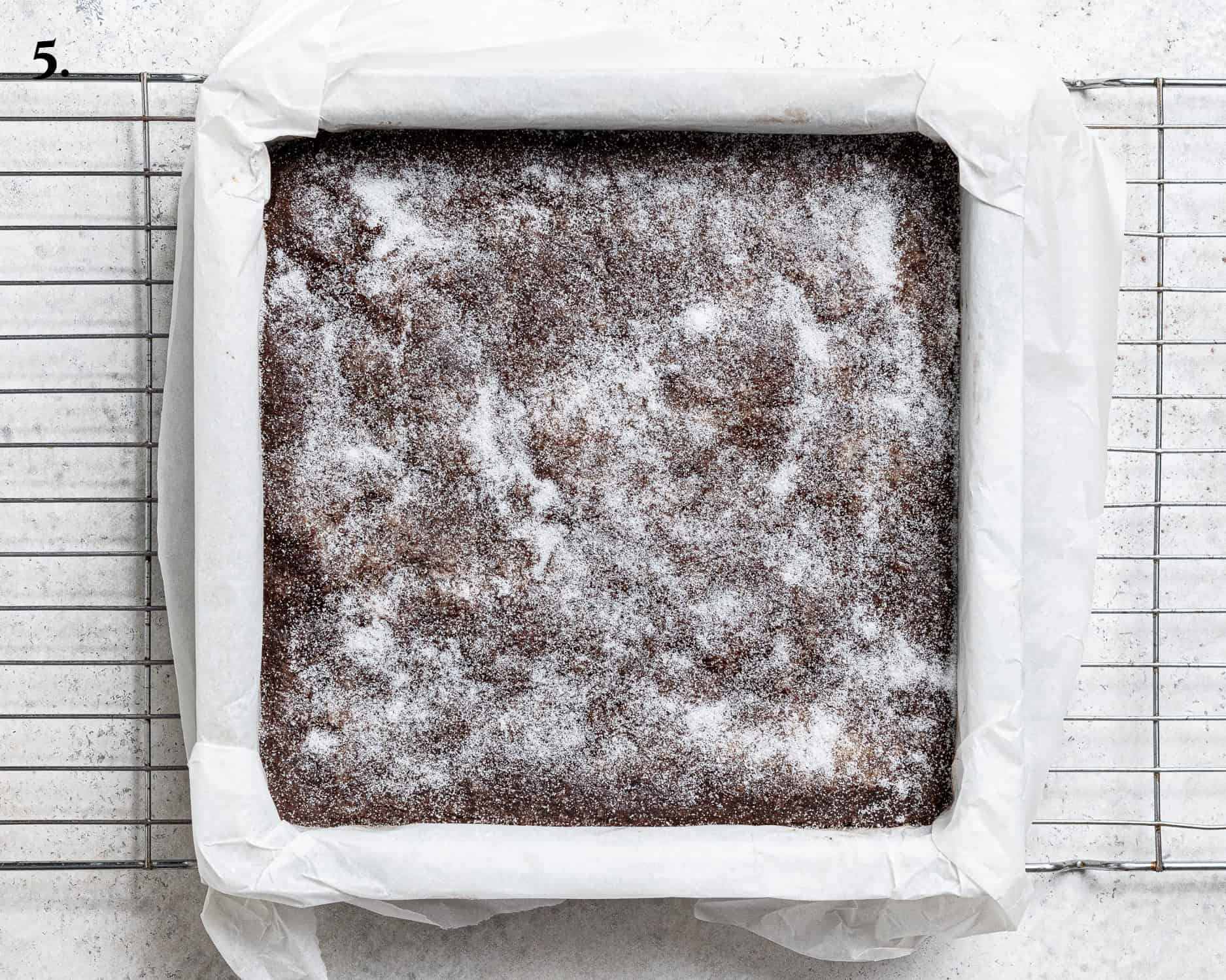 Step 5, the baked chocolate concrete sprinkled with sugar.