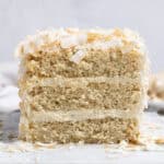 Close up of the end of the sliced vegan coconut cream cake.