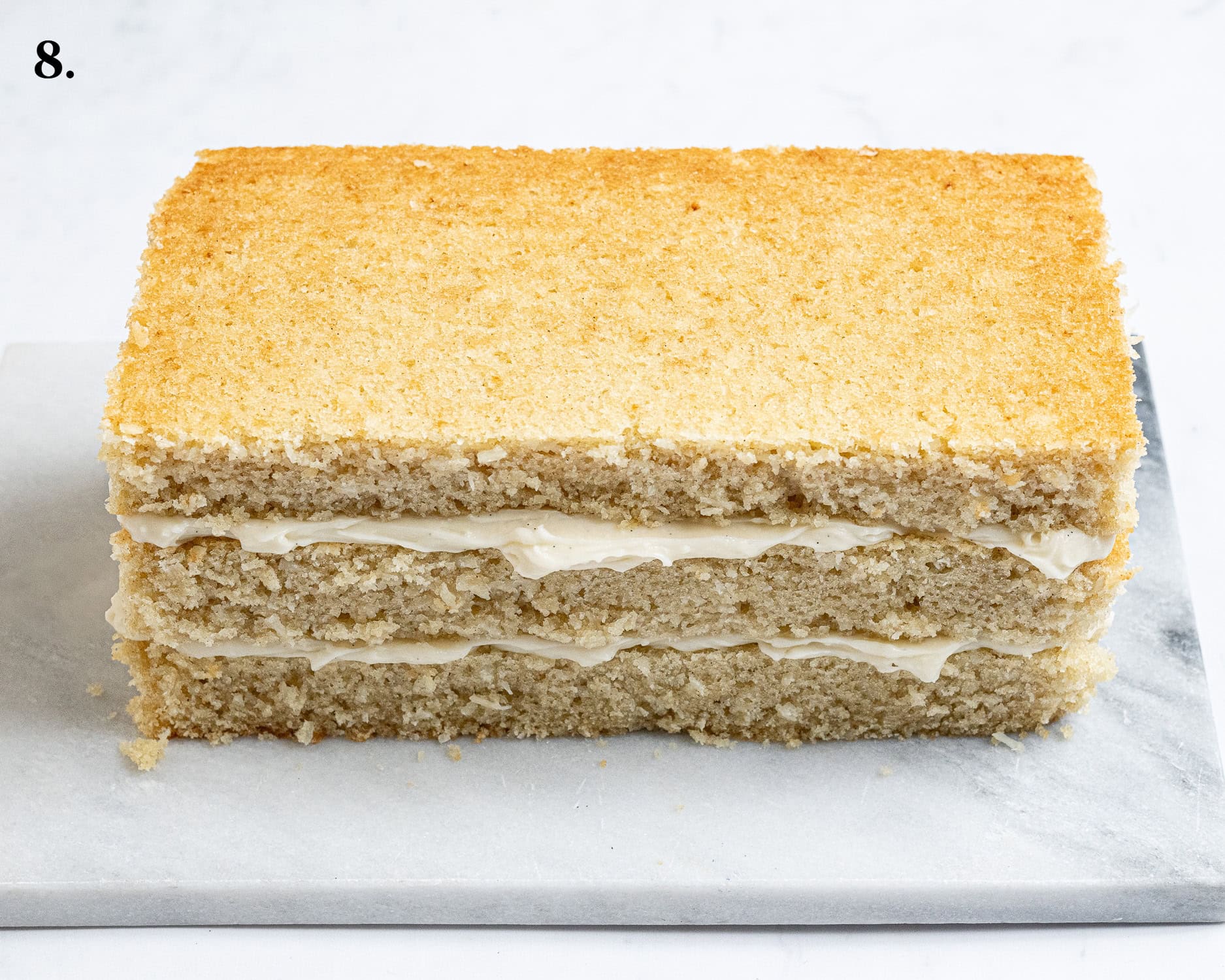 Step 8, the cake layers filled with pastry cream.