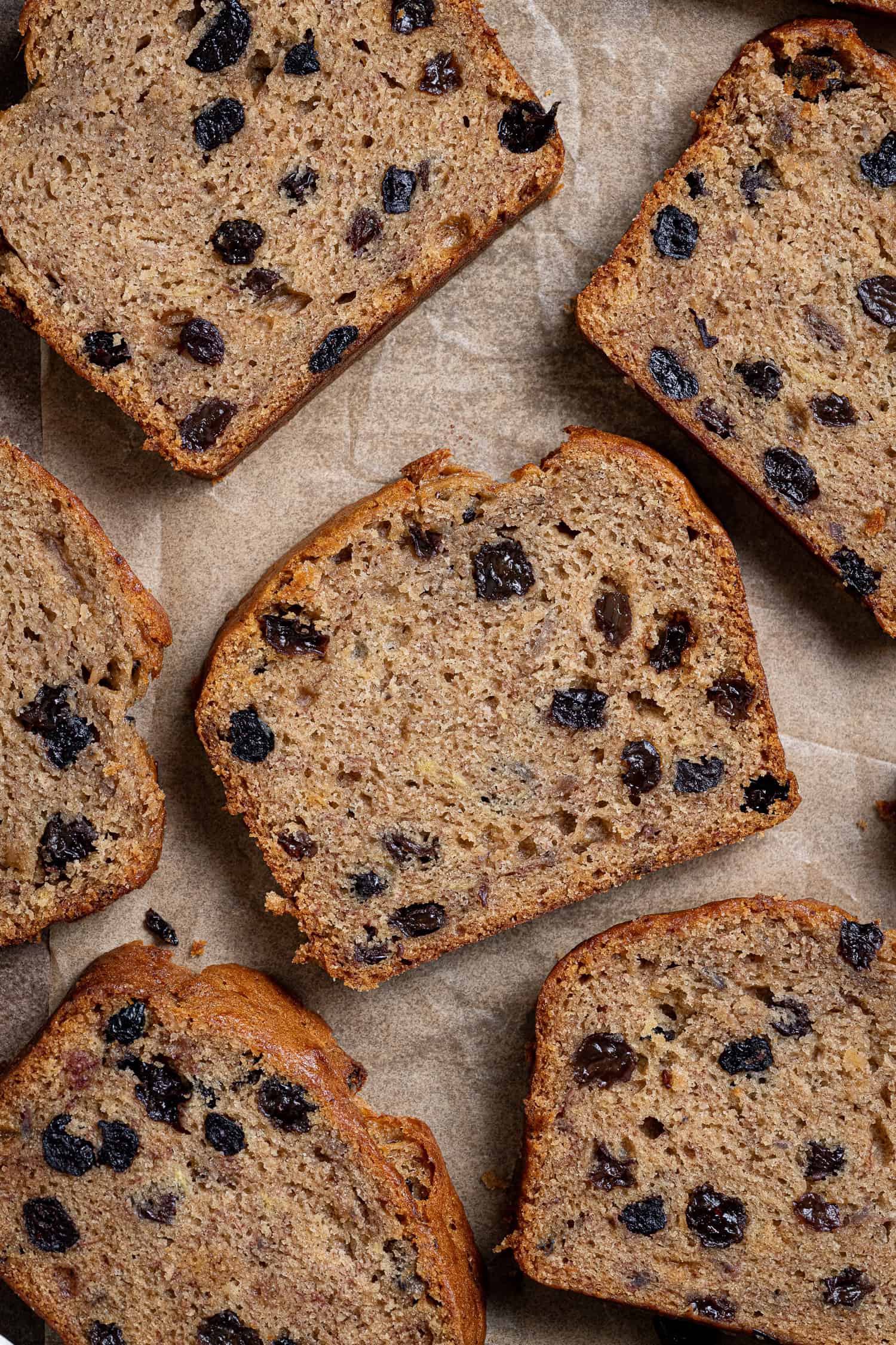 Flatlay of slices of rum raisin banana bread.