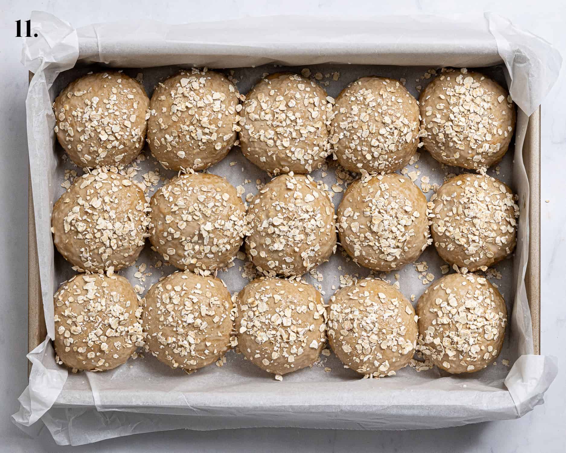 Step 11, the rolls brushed with milk and sprinkled with oats.